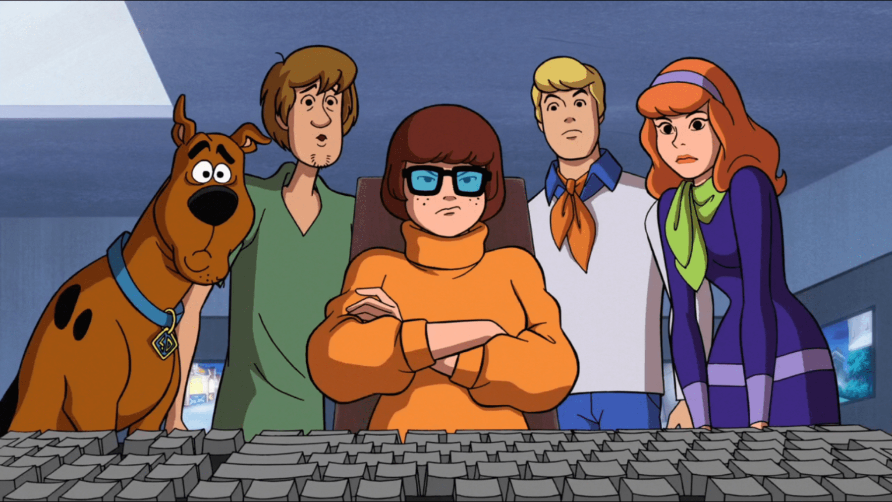scooby doo gang looking at a computer monitor trying to solve why a website is so slow