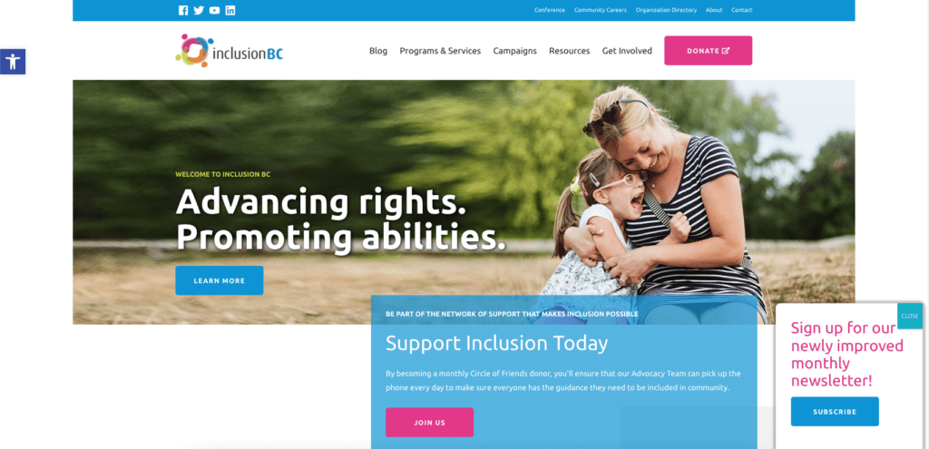 Screenshot showing Inclusion BC's homepage, which uses bright pink on CTA buttons 