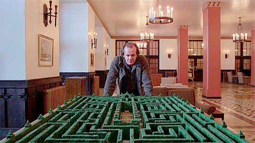 gif of Jack Nicholson in The Shining, studying a model of the famous maze that he runs through at the end of the movie