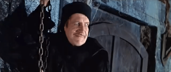 gif of Vincent Price in the movie The Pit and the Pendulum, pulling a chain to swing the pendulum 